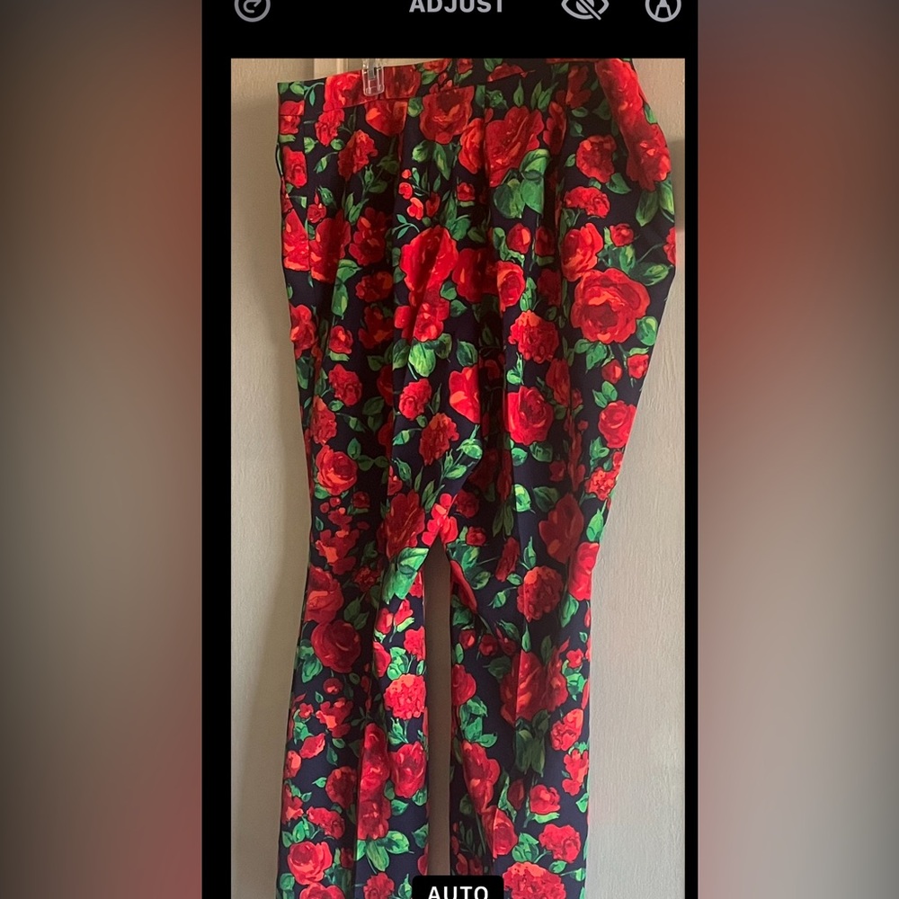 Brand new Black trousers with red roses. Material is soft and comfortable.